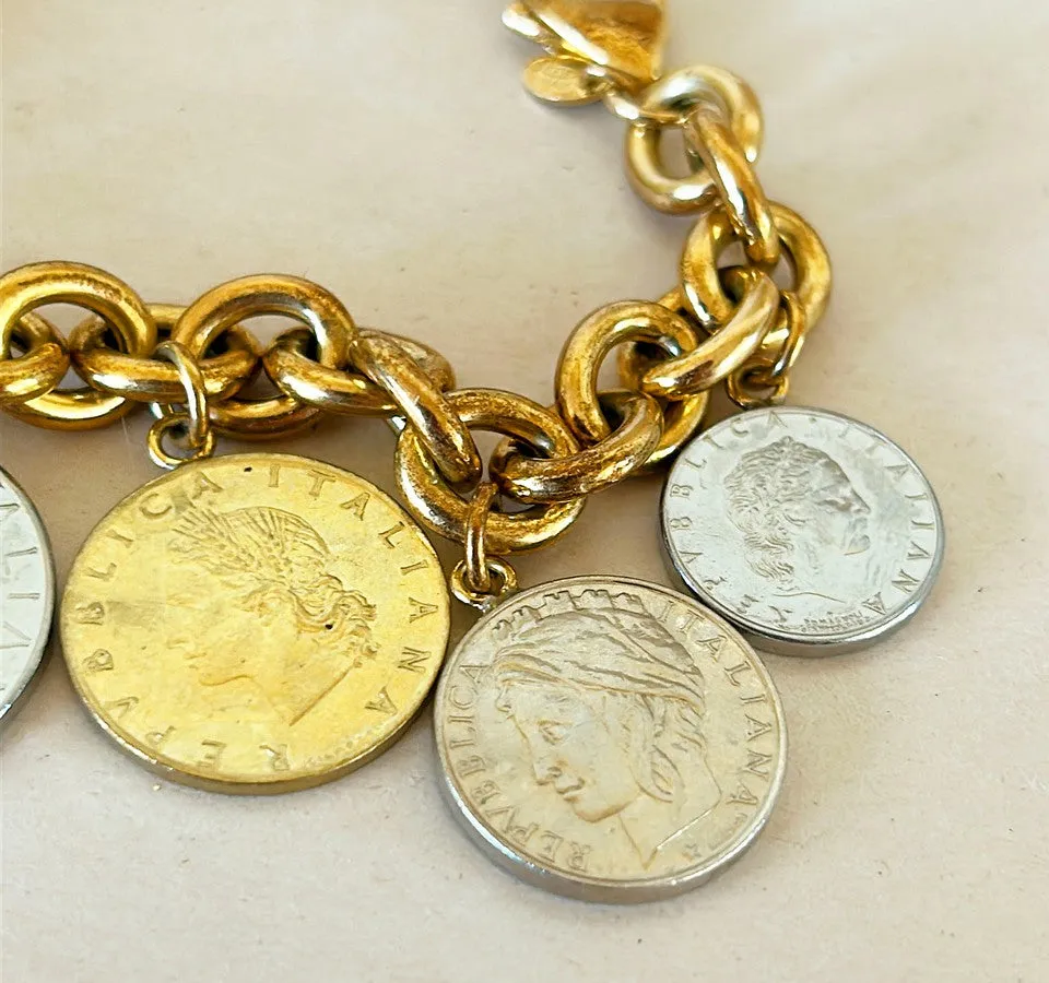 Amazing vintage Italian 18k gold over silver stamped Italian coin charm bracelet.