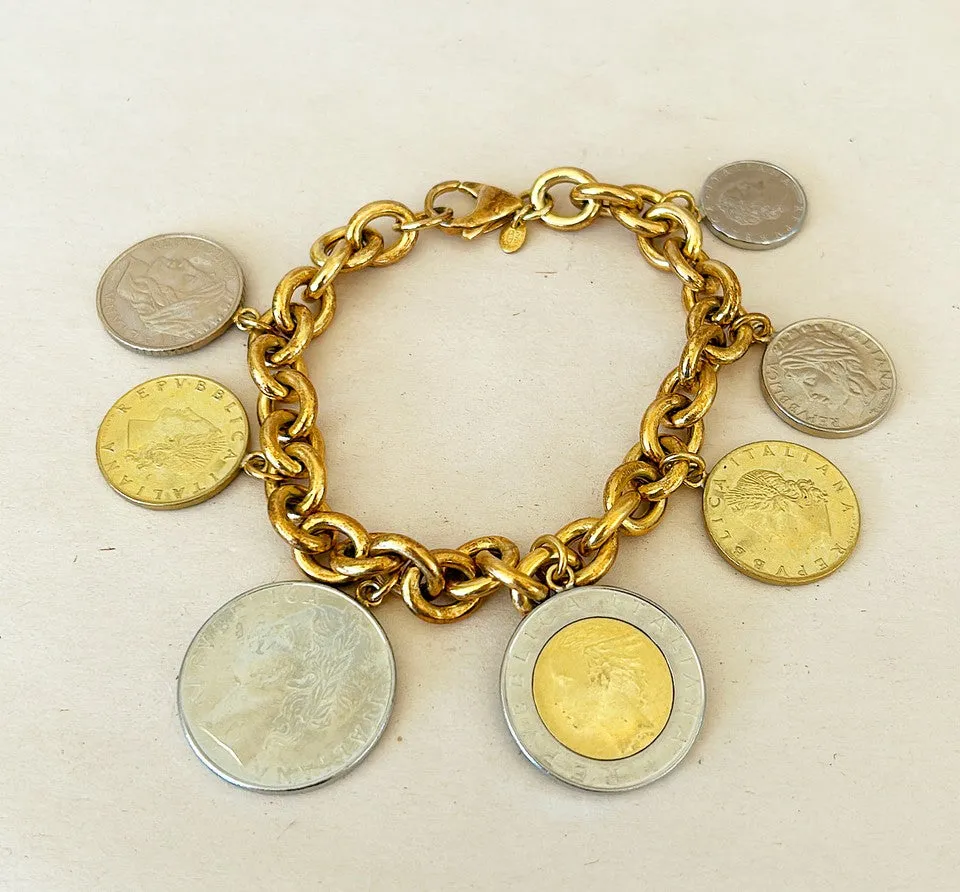Amazing vintage Italian 18k gold over silver stamped Italian coin charm bracelet.