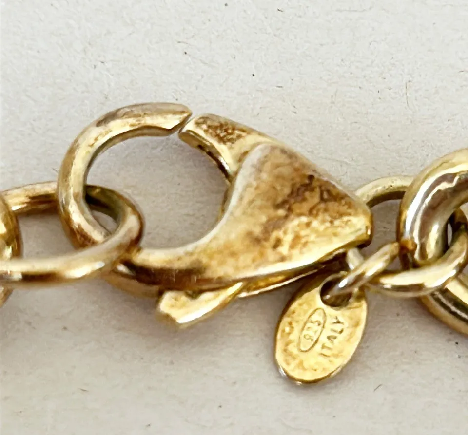 Amazing vintage Italian 18k gold over silver stamped Italian coin charm bracelet.