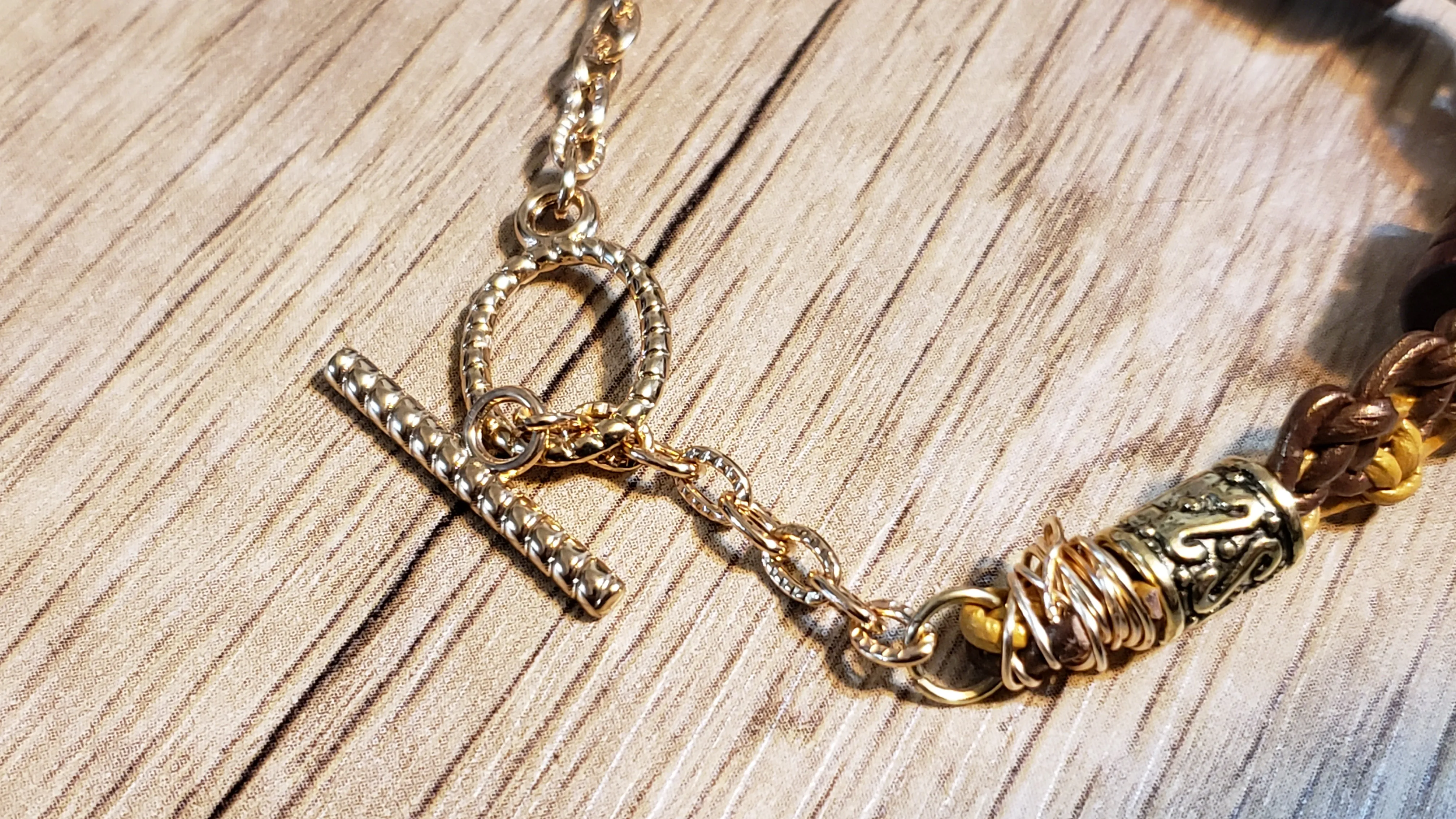 Genuine Leather Bracelet with Wood Beads & Non Tarnish Gold Tone Chain, 7.5" with Toggle Clasp.
 