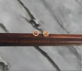 Liven 14k Rose Gold post with Raw Diamonds and a Diamond Halo.