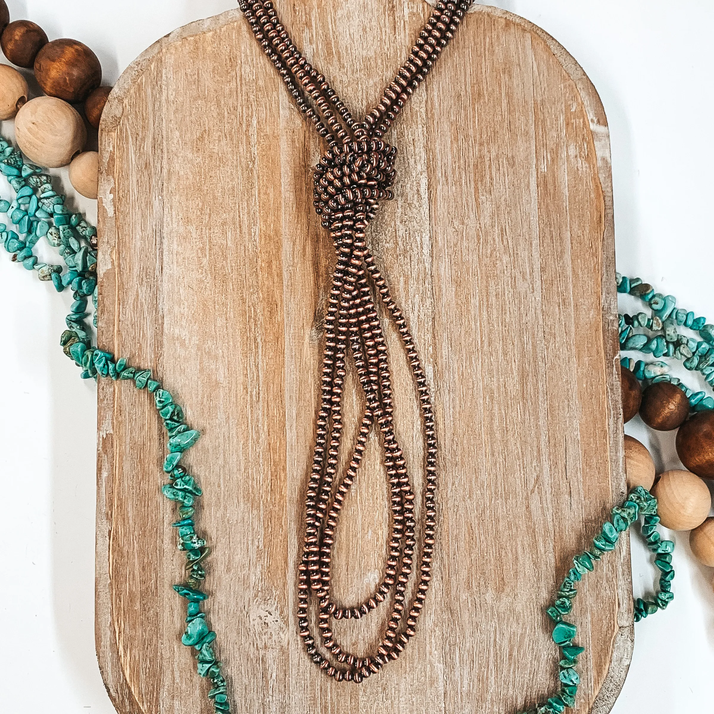 Three Strands of Long Faux Navajo Pearls in Copper Tone