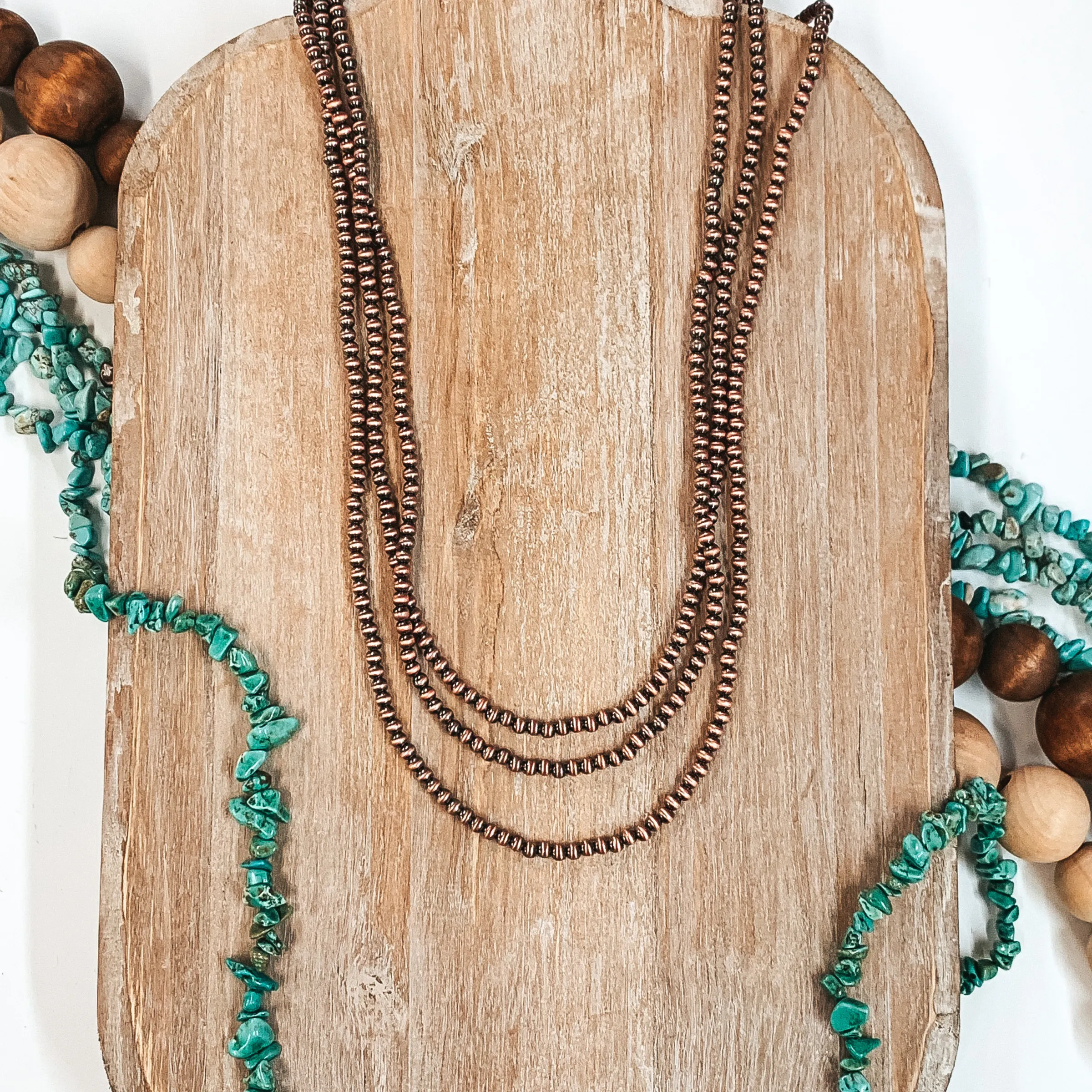 Three Strands of Long Faux Navajo Pearls in Copper Tone